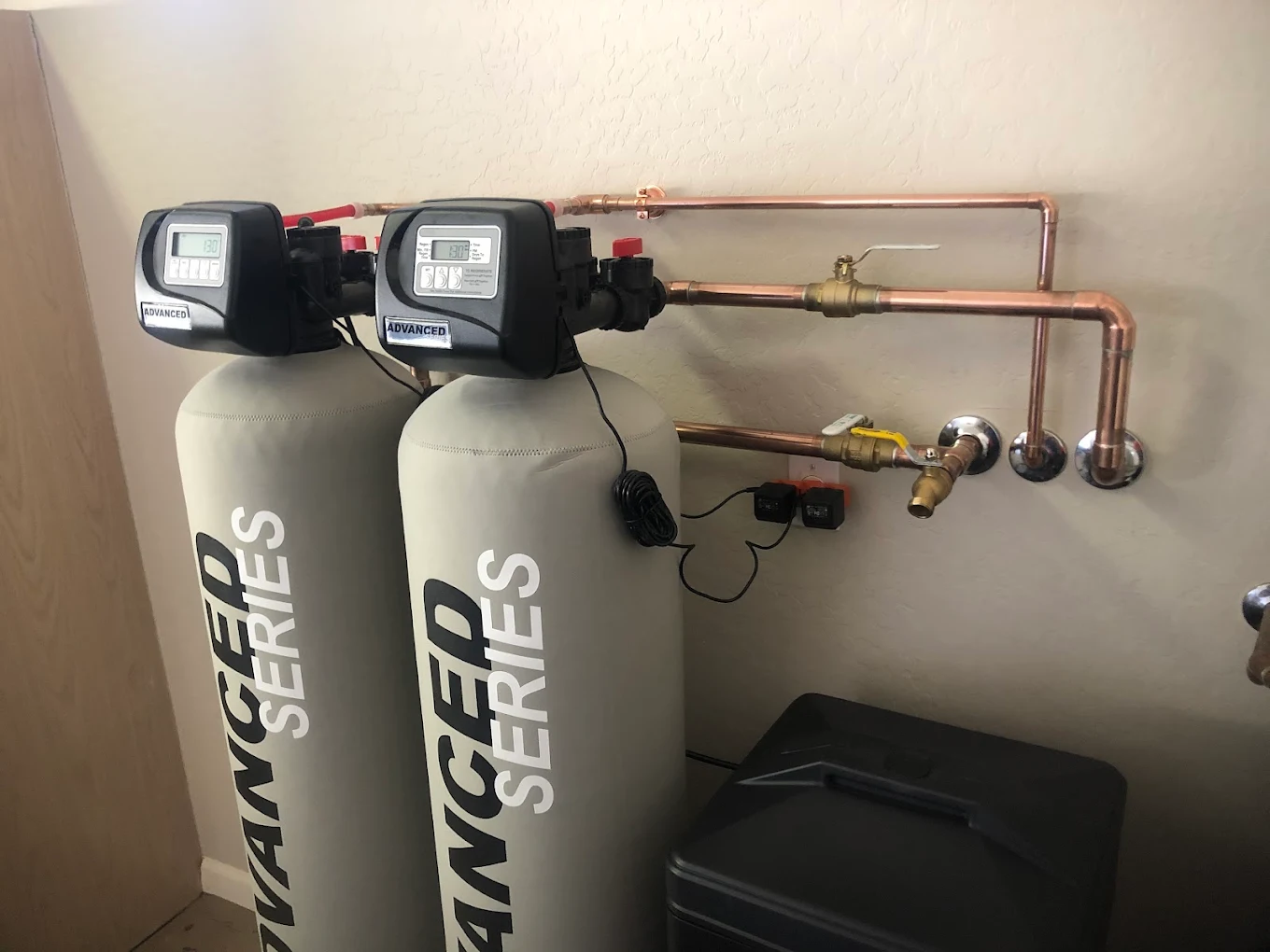 Dual whole-home Advanced Series water softener system with copper manifold